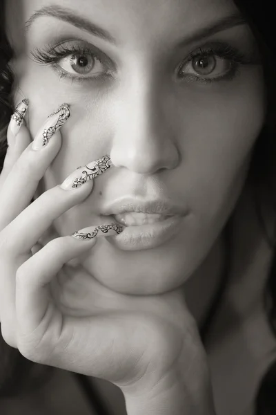 Brown toned portrait of attractive girl with manicure — Stock Photo, Image