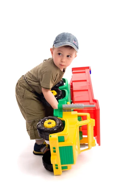 Menino jogar com brinquedo caminhão — Fotografia de Stock