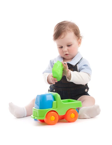 Portrait of adorable baby boy playing with toys — Stock Photo, Image