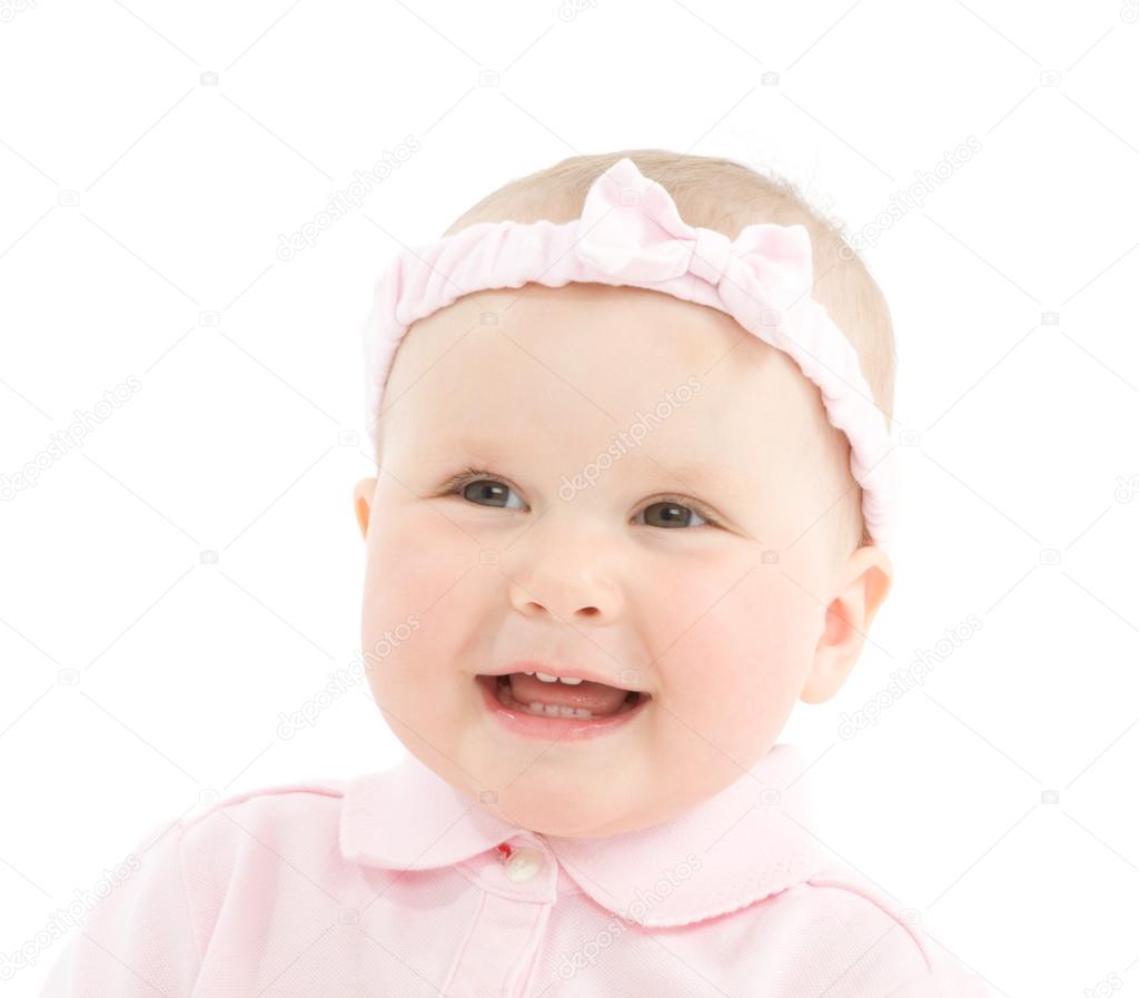 Happy face of baby girl with bowknot on head 