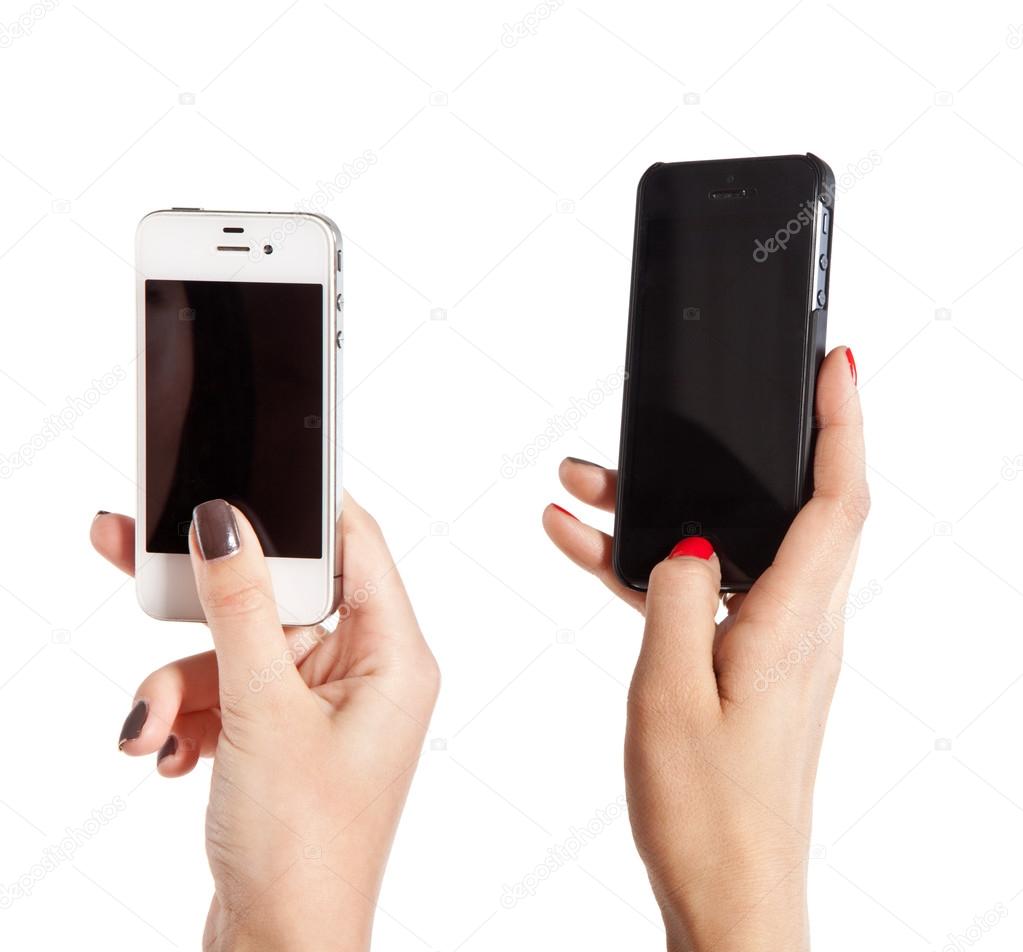 Two female hands take photos on mobile phones