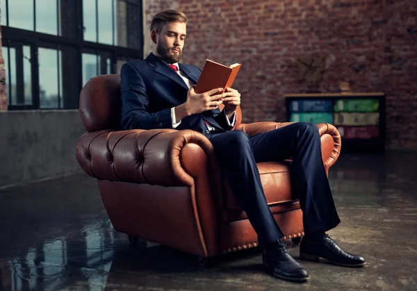 Businessman reading book