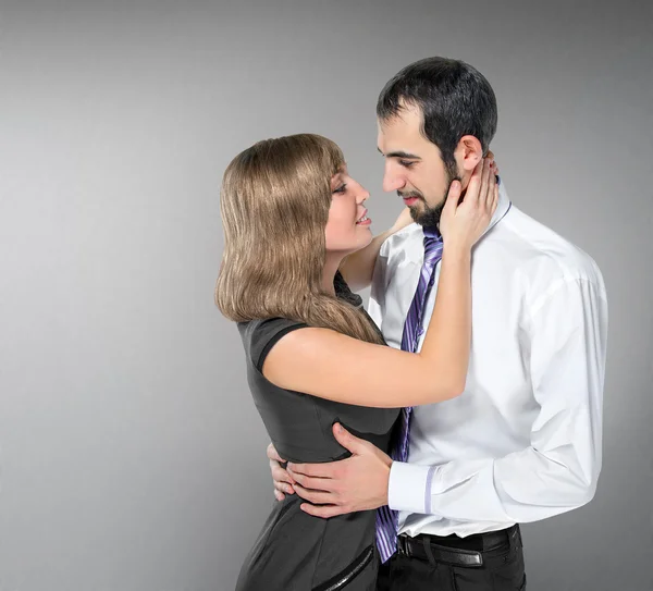 Embracing couple in love posing at studio — Stock Photo, Image