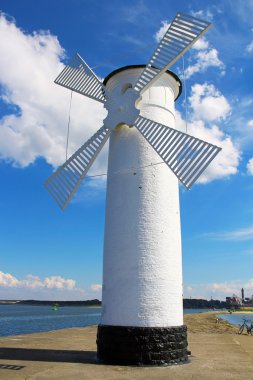 Lighthouse windmill in Swinoujscie, Poland clipart