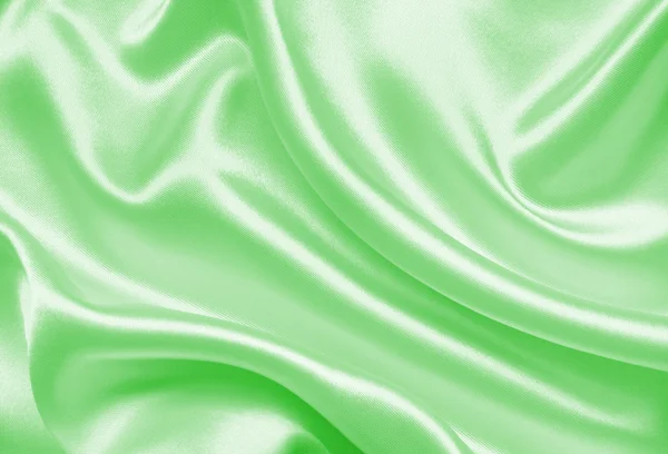 Soepele elegante groene zijde of Satijn textuur als achtergrond — Stockfoto