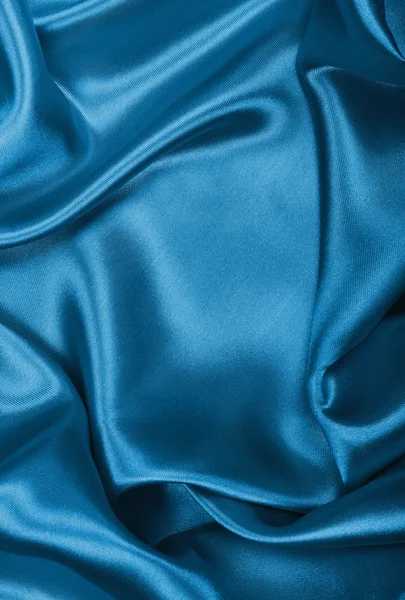 Seda azul elegante liso ou cetim como fundo — Fotografia de Stock