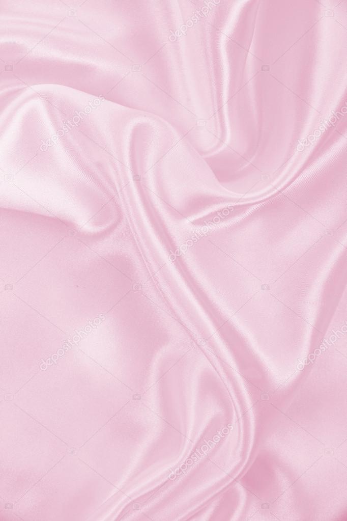 Smooth elegant pink silk or satin texture as background Stock
