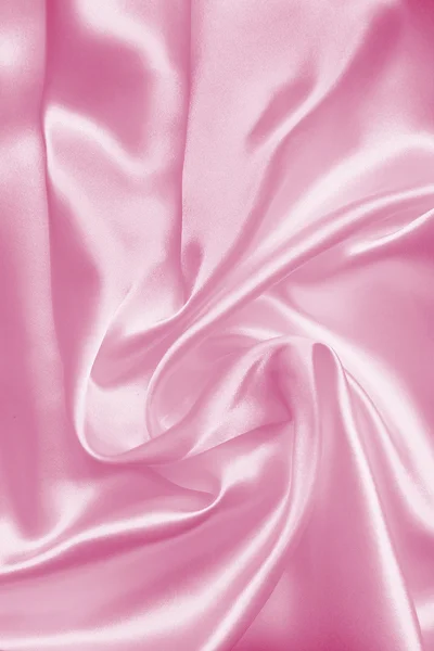 Sima, elegáns rózsaszín selyem, vagy szatén a textúra a háttér — Stock Fotó