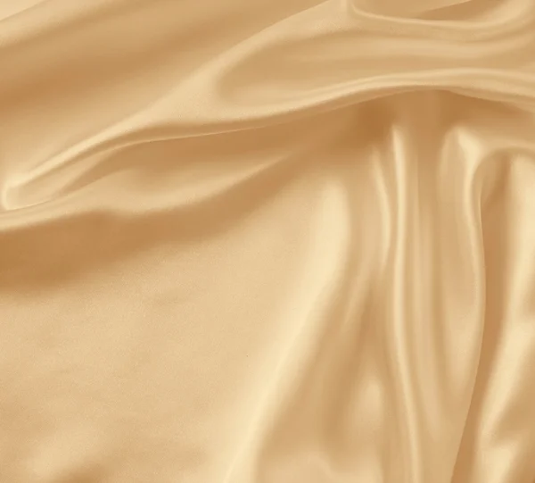 Glatte elegante goldene Seide als Hochzeitshintergrund. in Sepia getönt — Stockfoto