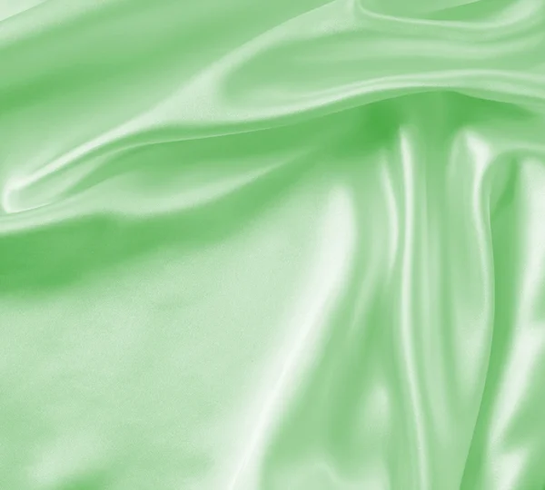 Гладка елегантна зелена шовкова або атласна текстура як фон — стокове фото