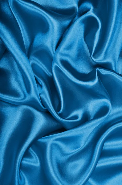 光滑的优雅蓝色丝绸或缎子为背景 — 图库照片