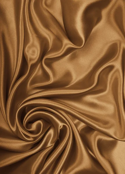 Smooth elegant golden silk as wedding background. In Sepia toned