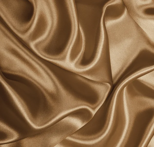 Glatte, elegante goldene Seide als Hintergrund. in Sepia getönt. retro — Stockfoto