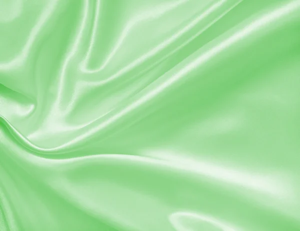 Ομαλή και κομψό πράσινο μετάξι ή σατέν υφή ως φόντο — Φωτογραφία Αρχείου