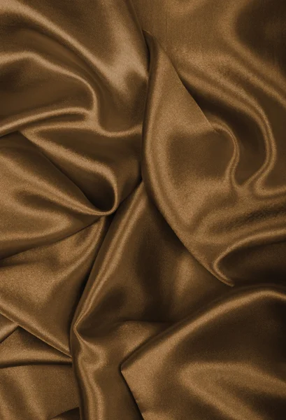 光滑的优雅棕色丝绸或缎子为背景。在成了棕褐色 — 图库照片