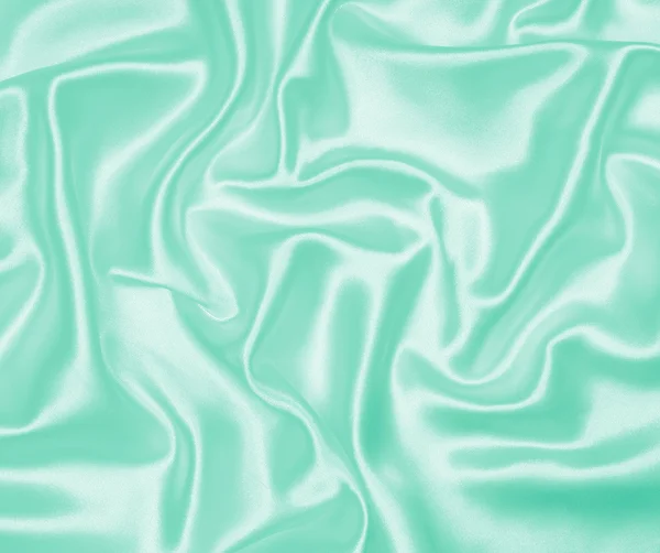 Гладкий элегантный зеленый шелк или атласная текстура в качестве фона — стоковое фото