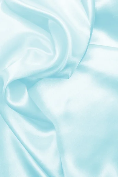 Hladké elegantní modré hedvábí nebo satén textury pozadí — Stock fotografie