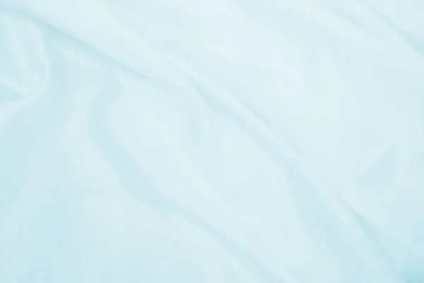 光滑典雅的蓝色丝绸或缎子的奢侈品面料可以用作抽象的背景 豪华背景设计 — 图库照片