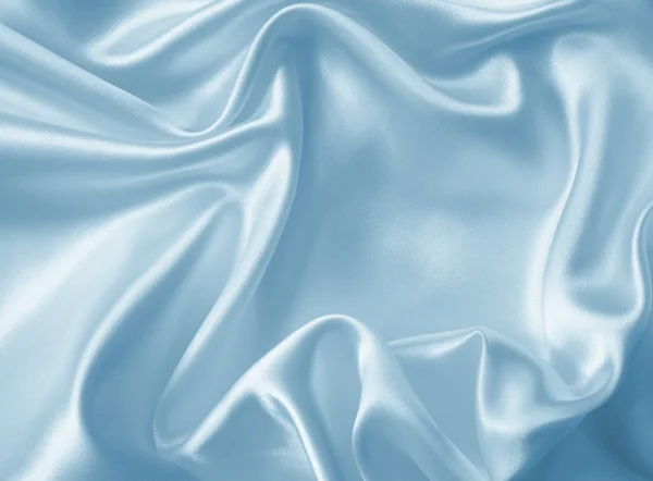 Gladde elegante blauwe zijde textuur — Stockfoto