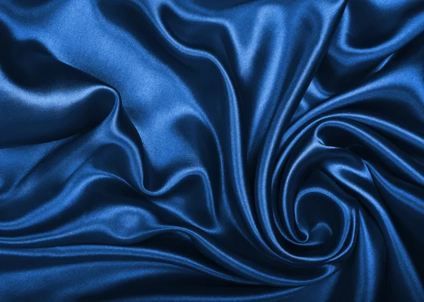 Soepele elegante blauw zijde of Satijn als achtergrond — Stockfoto