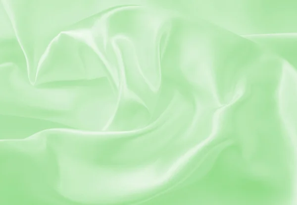 Sima, elegáns, zöld selyem vagy szatén a textúra a háttér — Stock Fotó
