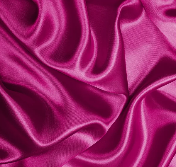 Texture lisse et élégante en soie rose ou satin comme fond — Photo