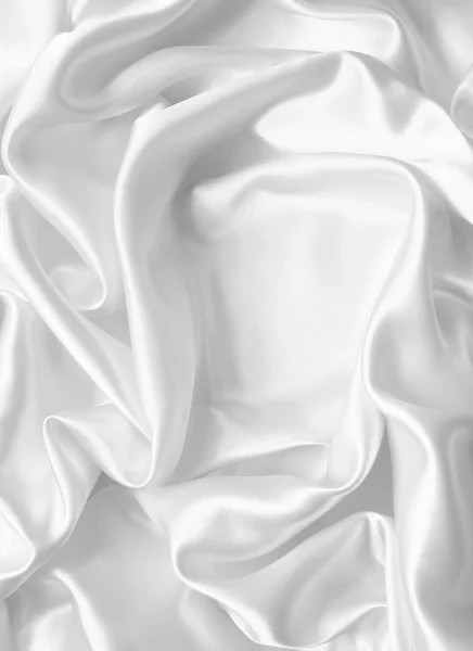 Smooth elegant white silk or satin as wedding background Stock Picture