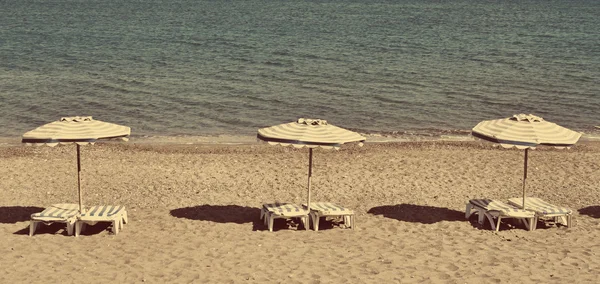 Greece. Kos. Kefalos beach. Chairs and umbrellas. In instagram s — Stock Photo, Image