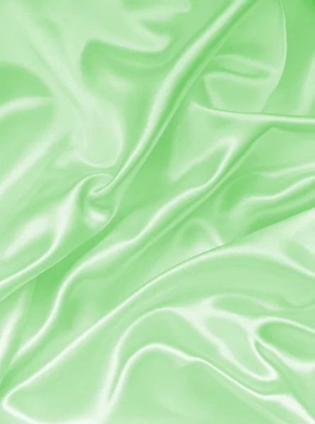 Гладка елегантна зелена шовкова або атласна текстура як фон — стокове фото
