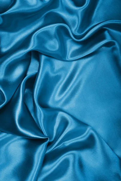 Glatte, elegante blaue Seide oder Satin als Hintergrund — Stockfoto