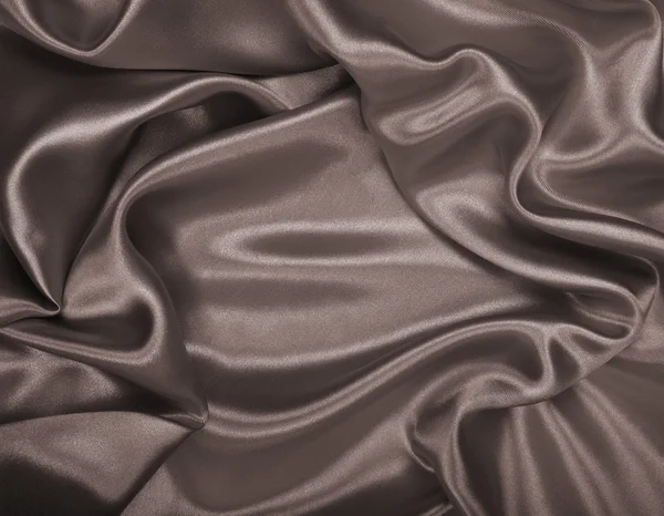 Smooth elegant brown silk or satin as background. In Sepia toned — Stock Photo, Image