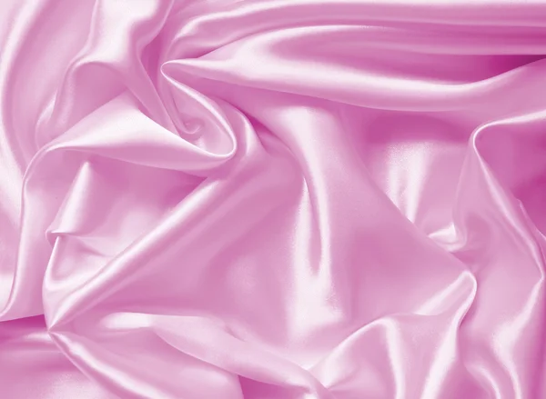 Hladké elegantní růžové hedvábí nebo satén textury pozadí — Stock fotografie