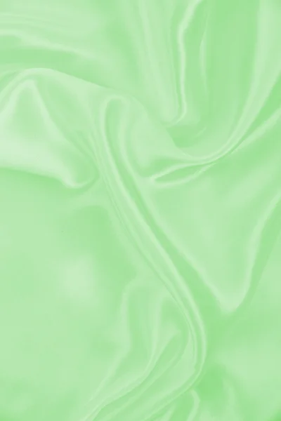 滑らかなエレガントな緑色の絹またはサテンの質感の背景として — ストック写真