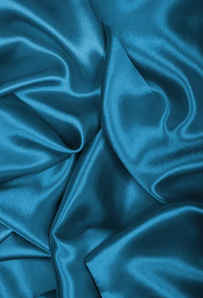 Glatte, elegante blaue Seide oder Satin als Hintergrund — Stockfoto