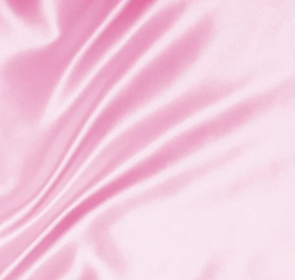 Гладкий элегантный розовый шелк или атласная текстура в качестве фона — стоковое фото
