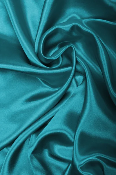 Glatte, elegante blaue Seide oder Satin als Hintergrund — Stockfoto