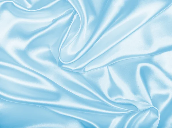 Seda azul elegante liso ou cetim como fundo — Fotografia de Stock