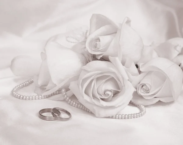 Wedding rings and roses. In Sepia toned. Retro style Stock Photo