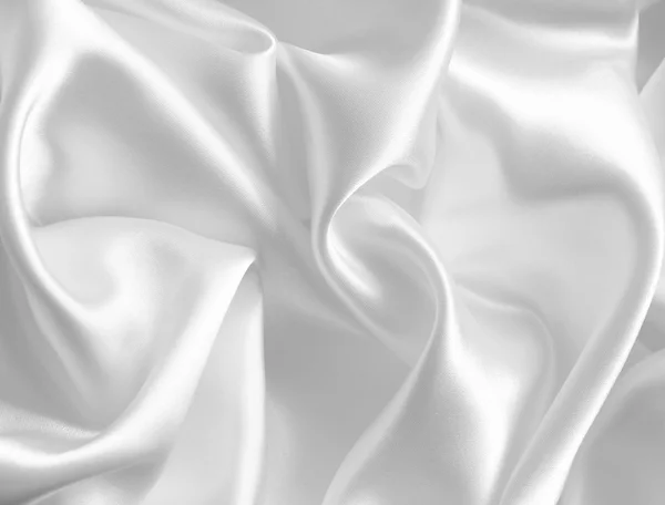 Hladké elegantní bílé hedvábí nebo satén jako svatební pozadí — Stock fotografie