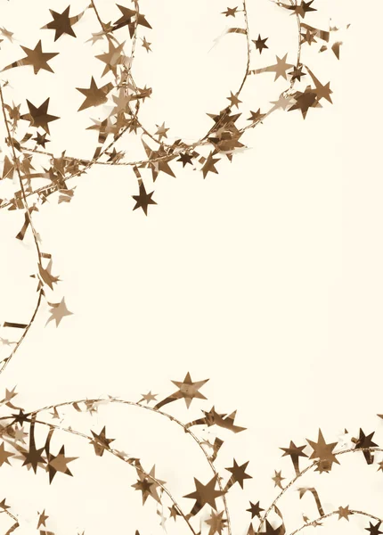金色的星星和花作为假日背景。在成了棕褐色. — 图库照片