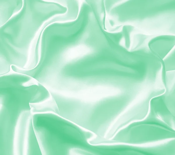 Smooth elegant green silk or satin texture as background Stock Picture