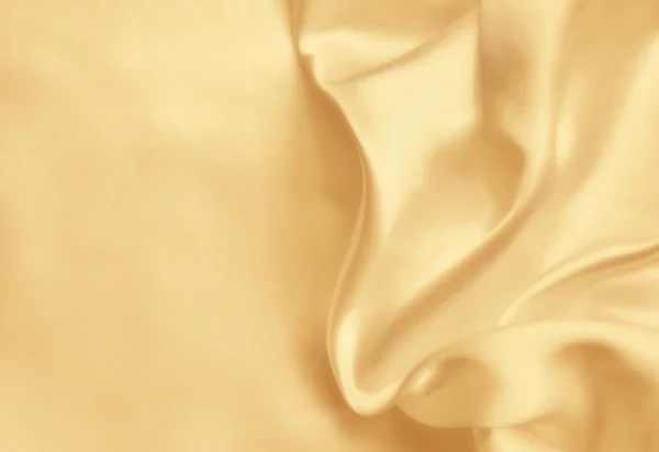 Ομαλή κομψό χρυσό μετάξι ως φόντο του γάμου. Σε σέπια τονισμένα — Φωτογραφία Αρχείου