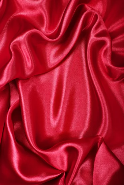 Soepele elegante rode zijde of Satijn als achtergrond — Stockfoto
