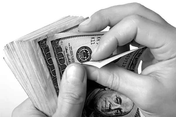 Efectivo Dólares estadounidenses en mano . — Foto de Stock