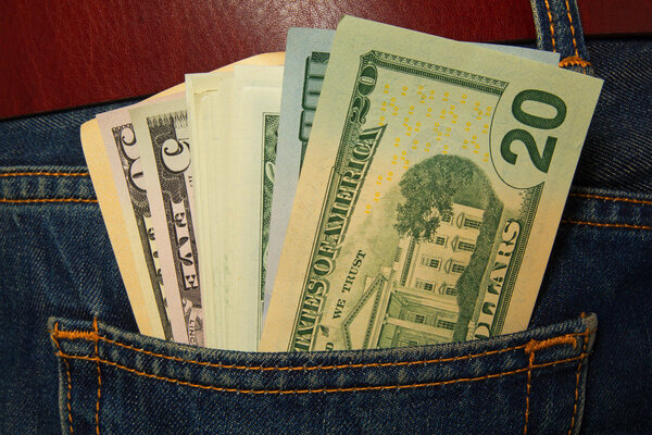 Dollars in jeans pocket.
