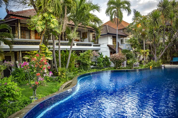 Small pool with clear water among tropical plants in Lovina, Bali island