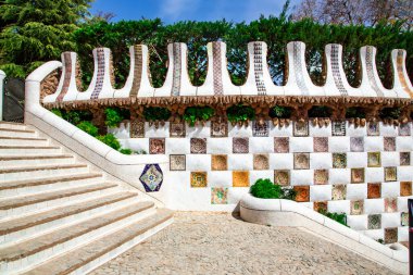 SPAIN, BARCELONA, MARCH, 2021- Beautiful mosaic wall at the central entrance to Park Guell, Barcelona