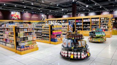 LATVIA, RIGA, JULY, 2021 - Shelves with quality products from different manufacturers in the shopping mall in Riga, Latvia.