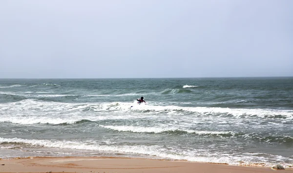 Surfer swims on a board in Mediterranean — Stock Photo, Image