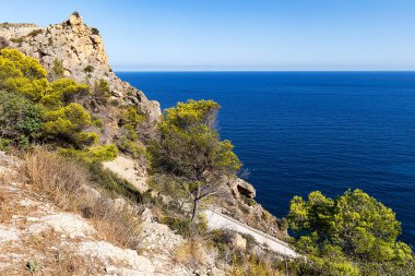 Rocky cliffs at Cala La Granadella with viewpoints overlooking the Mediterranean Sea, Javea, Costa Blanca, Alicante Province, Spain